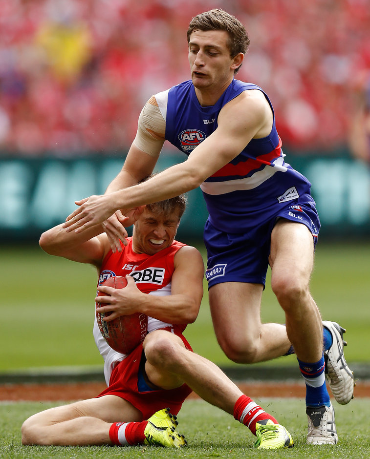 AFL 2016 Toyota AFL Grand Final - Sydney v Western Bulldogs MELBOURNE, AUSTRALIA - OCTOBER 01: Kieren Jack of the Swans is tackled by Fletcher Roberts of the Bulldogs during the 2016 Toyota AFL Grand Final match between the Sydney Swans and the Western Bulldogs at the Melbourne Cricket Ground on October 01, 2016 in Melbourne, Australia. (Photo by Michael Willson/AFL Media)